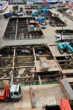 Asian labor people and thai labour worker use machine and heavy machinery working builder railway track electric sky train at construction site building on scaffold at capital city in Bangkok Thailand