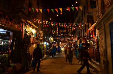 Parade of Nepalese people for celebration and respect praying rite to deity in diwali festival of lights of nepali ancient tradition in night time at Thamel city on November 3, 2013 in Kathmandu Nepal