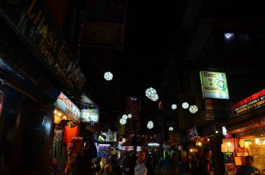Parade of Nepalese people for celebration and respect praying rite to deity in diwali festival of lights of nepali ancient tradition in night time at Thamel city on November 3, 2013 in Kathmandu Nepal