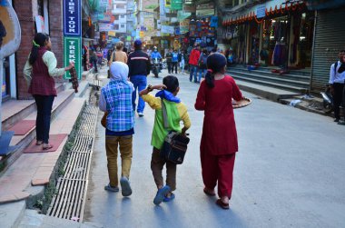 Children nepali boy and nepalese walking travel visit on street at thamel and playing with friend in Halloween festive and diwali festival celebration of lights on November 3, 2013 in Kathmandu, Nepal
