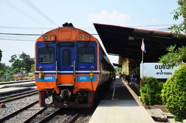 Local bogie locomotive train on track railway for send receive thai people and foreign travelers passengers journey go to destination at phra nakhon si ayutthaya on May 1, 2014 in Bangkok, Thailand