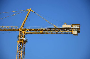 Asian labor people and thai labour workers use machine and heavy machinery working builder new structure tower high-rise building on scaffold at construction site at capital city in Bangkok, Thailand