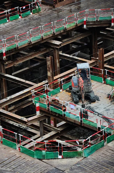 Asian labor people and thai labour workers use machine and heavy machinery working builder new structure tower high-rise building on scaffold at construction site at capital city in Bangkok, Thailand