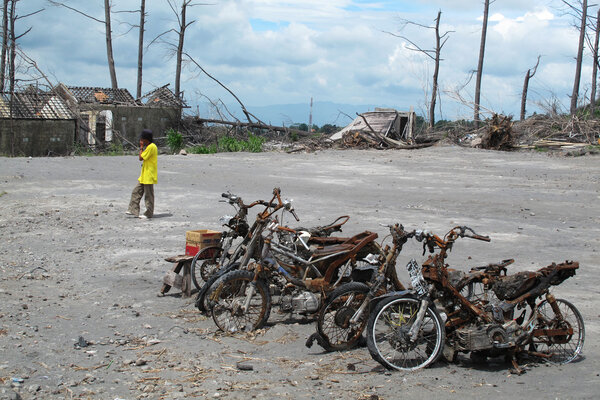 Burnt motorbike wrecks after volcano eruption