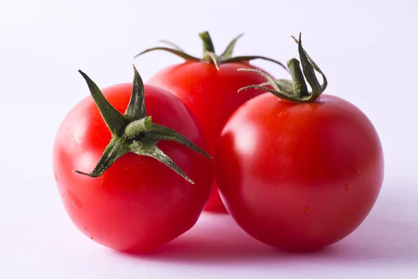 Three fresh cherry tomatoes — Stock Photo, Image