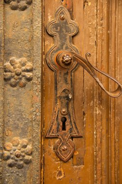 Old and rusty wrought iron door handle clipart
