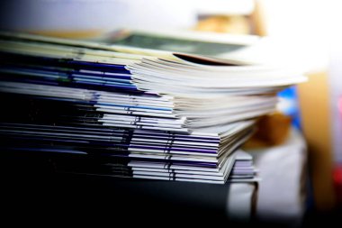 Stacks of magazines and annual report books on the shelves. in the university library