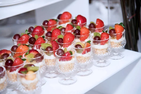 Glass of fresh fruit and cream cheese at a party