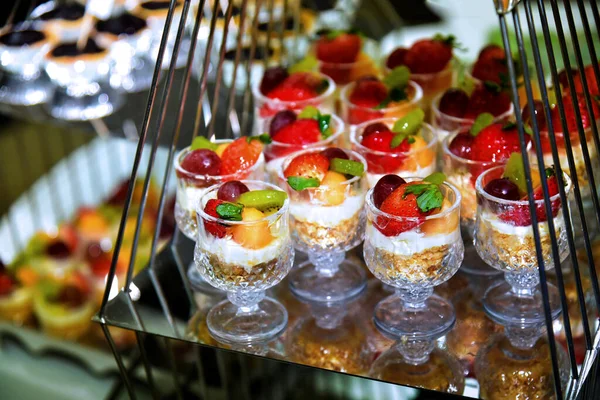 Creamy fruit in a glass bowl on the table at a party.
