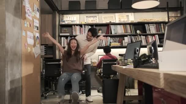 Two Asian Coworkers Friends Jokingly Tease Laugh Together Smile Sliding — Vídeo de Stock