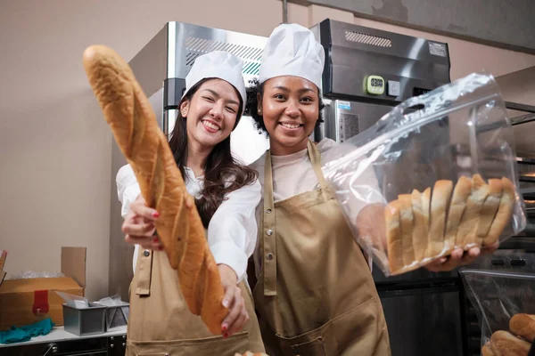 Portrait Young Female Chefs Apron Uniforms Hats Looking Camera Cheerful —  Fotos de Stock