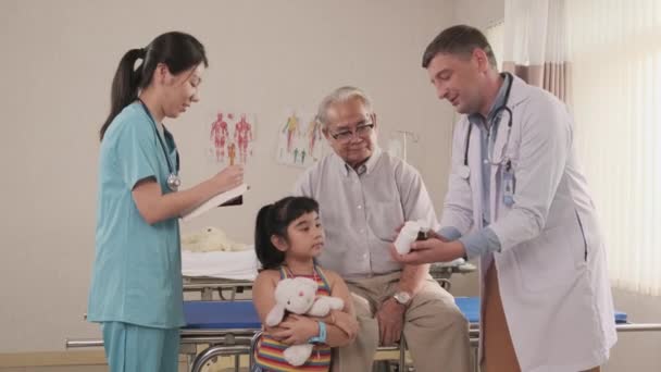 Professional Caucasian Male Doctor Advises Grandfather Explains Prescription Medicines Medical — стоковое видео