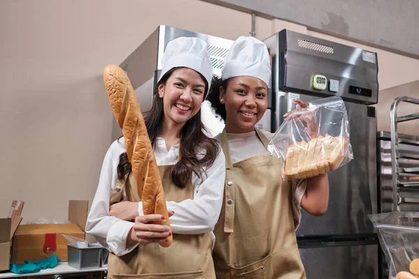 Portrait Young Female Chefs Apron Uniforms Hats Looking Camera Cheerful —  Fotos de Stock