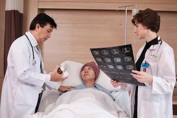 Two Professional Doctors Team Uniform Diagnosis Discuss Ray Film Explain — Stok fotoğraf