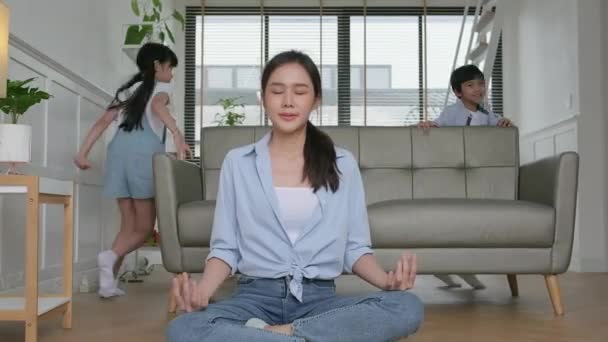 Young Asian Thai Mother Sits Living Room Floor Meditates Practices — Stockvideo