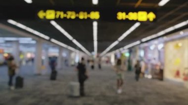 Wide blurred footage: People walking at pedestrian walkway, hurrying at boarding gate at Don Mueang International Airport terminal, Journey to travel destinations with luggage at departure lobby hall.