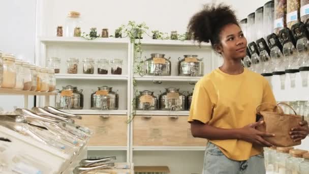 Young African American Woman Choosing Shopping Organic Products Refill Store — Vídeos de Stock