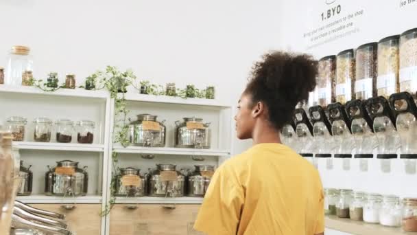 Young African American Woman Choosing Shopping Organic Products Refill Store — 비디오