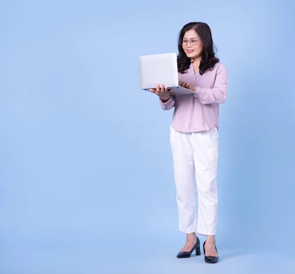 Full Length Image Middle Aged Asian Woman Blue Background — Fotografia de Stock