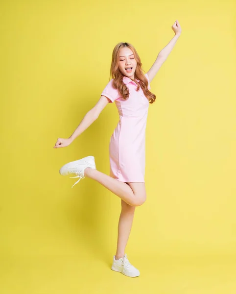 Full Length Image Young Asian Girl Standing Yellow Background — стокове фото
