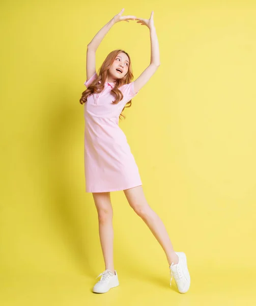 Full Length Image Young Asian Girl Standing Yellow Background — Foto Stock