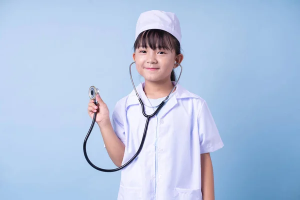 Image Asian Child Wearing Doctor Uniform Blue Background — Stock Fotó
