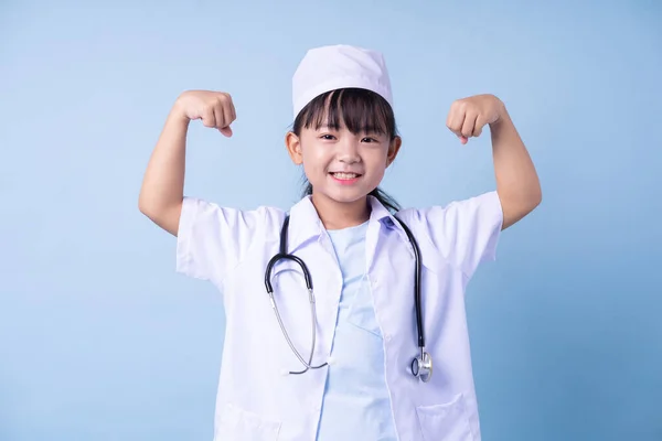 Image Asian Child Wearing Doctor Uniform Blue Background — стокове фото