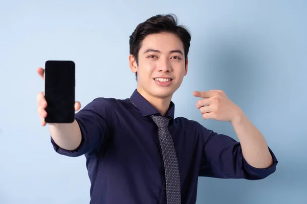 Portrait Young Asian Businessman Using Smartphone Blue Background — Foto Stock