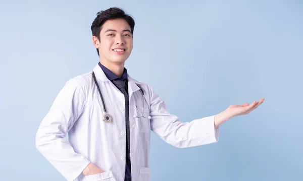 Portrait Young Asian Male Doctor Blue Background — 스톡 사진