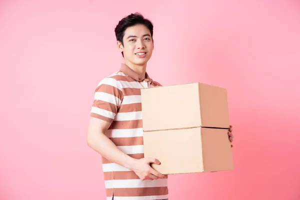 Image Young Asian Man Holding Cardboard Pink Background — Stock Fotó