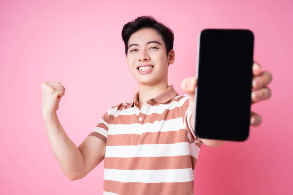 Portrait Young Asian Man Using Smartphone Pink Background — стоковое фото