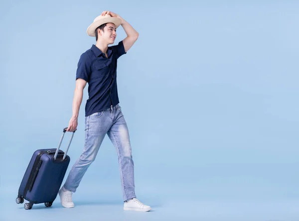 Image Young Asian Man Holding Suitcase Blue Background Travel Concept — Zdjęcie stockowe