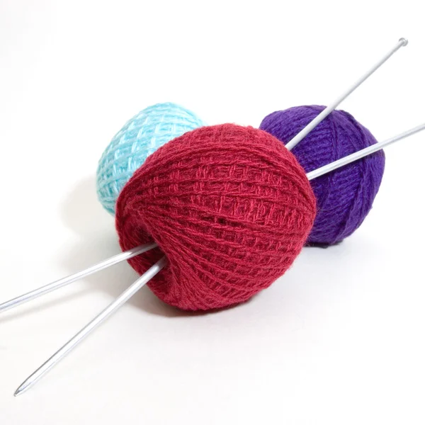 Three wool balls and knitting needles — Stock Photo, Image