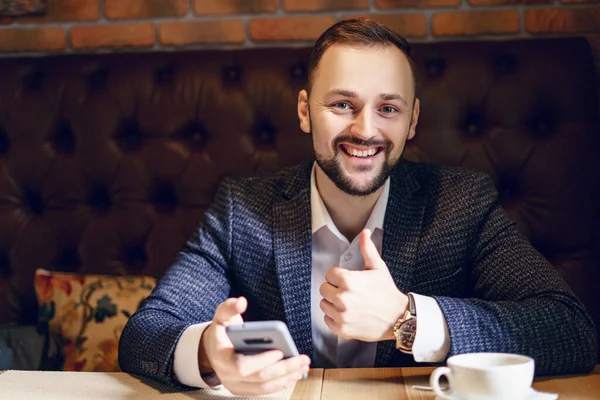 Young Man Neat Beard Dressed Business Suit Smartphone Cup Coffee — Foto Stock