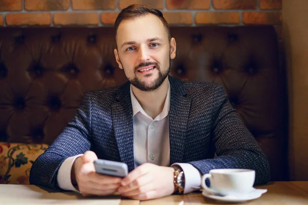 Young Man Neat Beard Dressed Business Suit Smartphone Cup Coffee — Photo