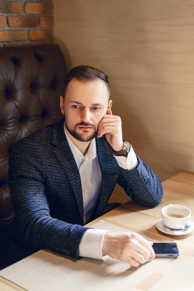 Young Man Neat Beard Dressed Business Suit Smartphone Cup Coffee — Photo