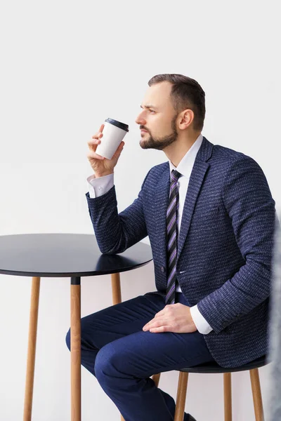 Young Man Business Suit Small Table Drinking Coffee Tea White — Foto de Stock