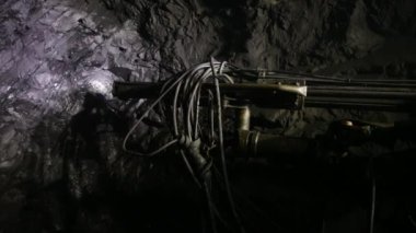 The process of drilling wells in an iron ore mine. Part of the technological process for mining minerals in an underground mine.