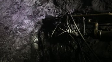 The process of drilling wells in an iron ore mine. Part of the technological process for mining minerals in an underground mine.