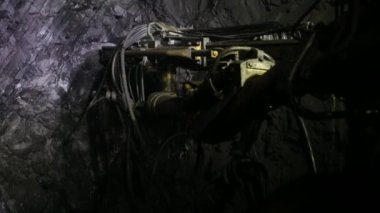 The process of drilling wells in an iron ore mine. Part of the technological process for mining minerals in an underground mine.