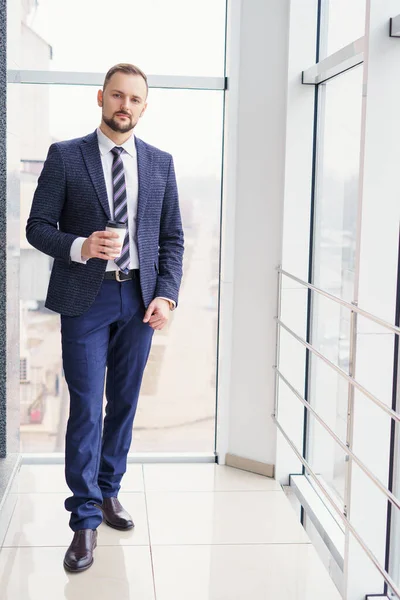 Young Man Business Suit Cup Coffee Stands Large Window Looks — Photo