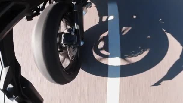 A motorcyle wheel perspective in summer on the road — Stock Video