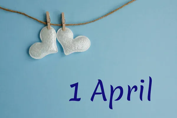 Commemorative Date April Blue Background White Hearts Clothespins Flat Lay — Stock Photo, Image