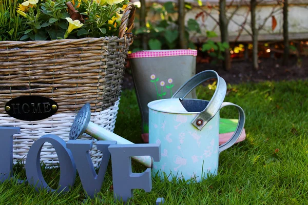 Cute garden set on a spring grass — Stock Photo, Image