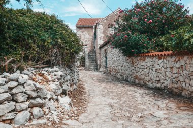 Beautiful old streets in Croatia. Architecture of southern Europe. Old sights and houses.
