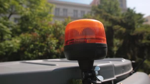 Orange flashing light on utility vehicle flashing creating safe zone. — Stock Video