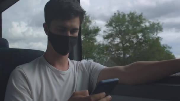 Man uses phone, he buys ticket mobile application transport bus fare payment. — Stock Video