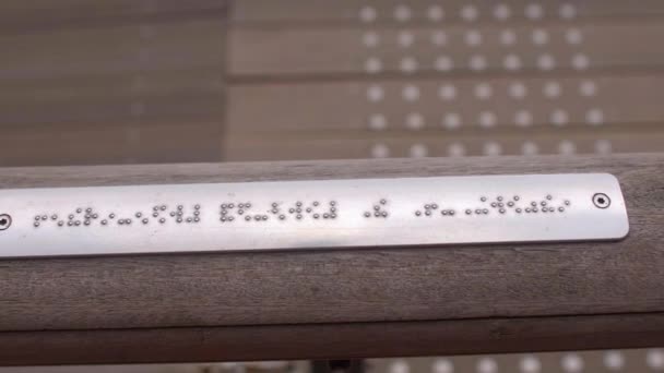 Hand touches text in Braille. Self-service skills, ability to navigate in space. — Vídeo de stock