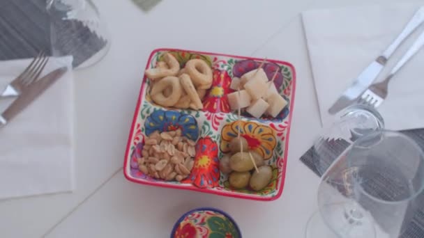 Snack on the table in plates. Top view. Appetizers is served before a meal. — Stock Video