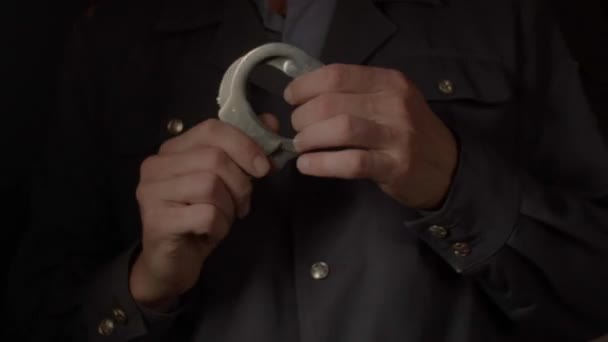 Aggression and violent submission to his power. Closeup of hands with handcuffs. — Stock Video